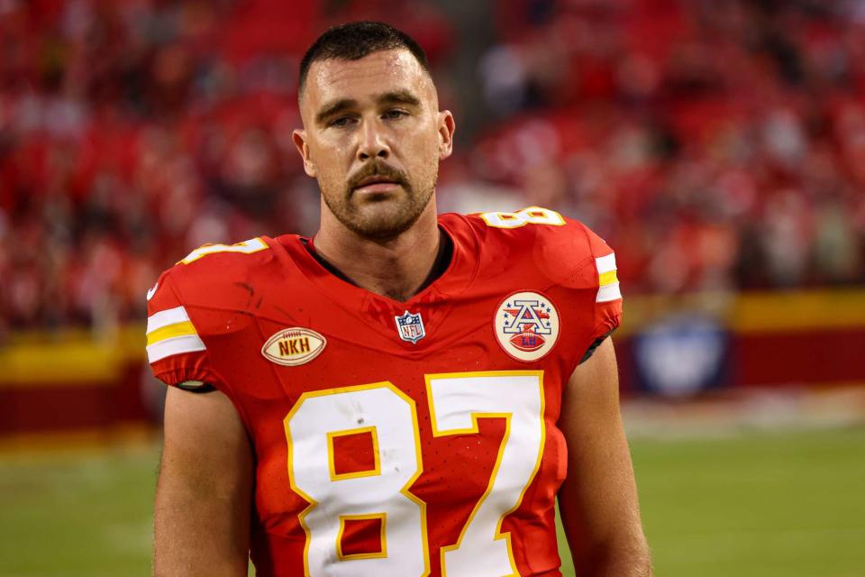 <p>Perry Knotts/Getty </p> Travis Kelce #87 of the Kansas City Chiefs warms up prior to an NFL football game against the Denver Broncos on October 12, 2023 