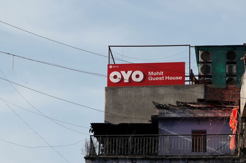 FILE PHOTO: The logo of OYO, India's largest and fastest-growing hotel chain, is seen installed on a hotel building in New Delhi