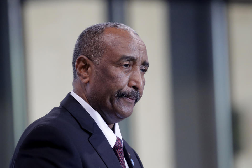 FILE - In this May 17, 2021 file photo, Gen. Abdel-Fattah Burhan, head of Sudan's ruling sovereign council speaks during a session of the summit to support Sudan, at the Grand Palais Ephemere in Paris. Burhan declared a state of emergency Monday, Oct. 25, 2021, hours after his forces arrested the acting prime minister and disrupted the internet in an apparent coup as the country was nearing a planned transition to a civilian leadership. In a televised address, Burhan announced that he was dissolving the country’s ruling Sovereign Council, as well as the government led by Prime Minister Abdalla Hamdok. (AP Photo/Christophe Ena, Pool, File)