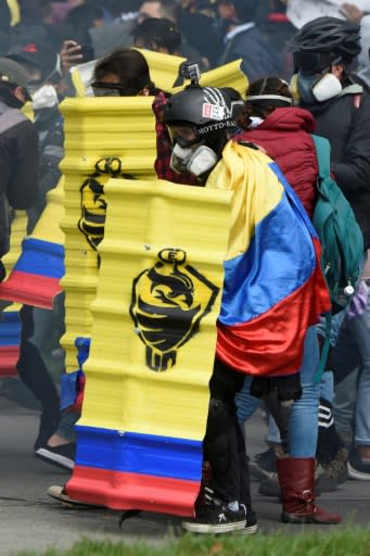 Demonstrators clash with riot police in Bogota during anti-government protests