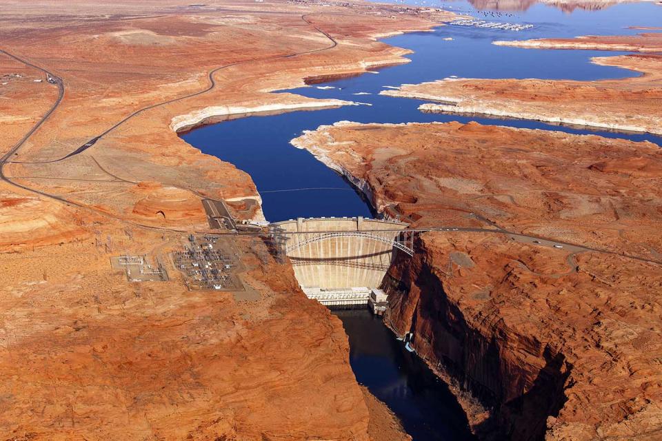 <p>Glen Canyon Bridge and Dam, Arizona. The bridge has an overall length of 1,271 feet (387 m) with a deck 700 feet (210 m) above the Colorado river, making it one of the highest bridges in the US. It was completed in 1959. The dam was completed just a few years later, in 1966. (Photo: Jassen Todorov/Caters News) </p>