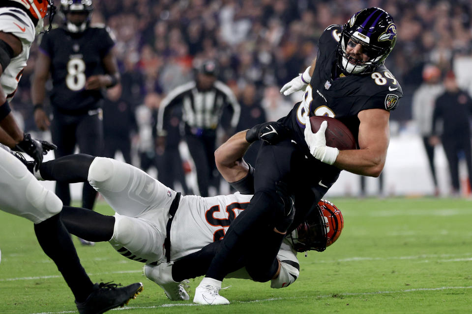 Mark Andrews of the Baltimore Ravens was tackled by Logan Wilson of the Cincinnati Bengals, a play that took Andrews out of the game.  (Photo by Patrick Smith/Getty Images)