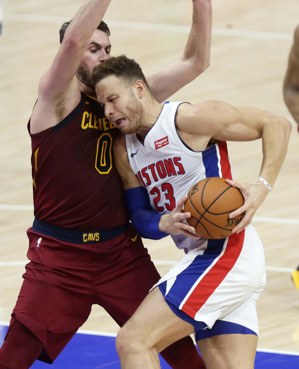 Detroit Pistons forward Blake Griffin, right, drives to the basket against Cleveland Cavaliers forward Kevin Love, left, during the first half of an NBA basketball game Saturday, Dec. 26, 2020, in Detroit. (AP Photo/Duane Burleson)