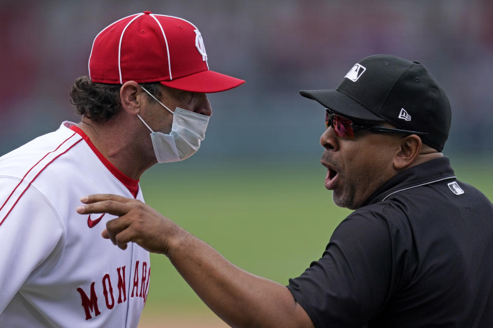 Kansas City Royals manager Mike Matheny talks with first base umpire Adrian Johnson before getting ejected during the sixth inning of a baseball game against the Detroit Tigers Sunday, May 23, 2021, in Kansas City, Mo. (AP Photo/Charlie Riedel)