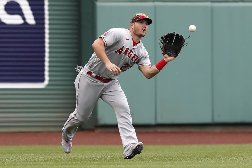 Los Angeles Angels' Mike Trout makes the catch on the line out by Boston Red Sox's J.D. Martinez.