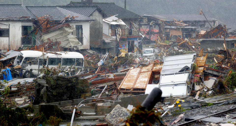 Debris is scattered at a residential area hit by heavy rain in Kumamura, Kumamoto prefecture, southern Japan Tuesday, July 7, 2020. Rescue operations continued and rain threatened wider areas of the main island of Kyushu. (Kota Endo/Kyodo News via AP)