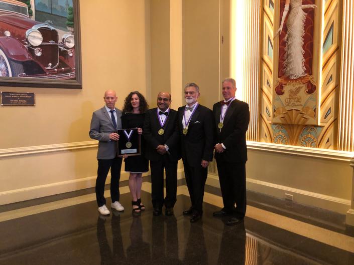 The 2022 inductees for the Distinguished Dental Service Academy assemble for a group picture at the Stark County Dental Society Friday at the Historic Onesto Hotel. From right to left are dentists Tom Paumier, Andrew Wojtkowski and K. &quot;Ragu&quot; Ragunanthan. Representing deceased inductee Harvey Cohen are his daughter Faith Cohen and his son Greg Cohen.
