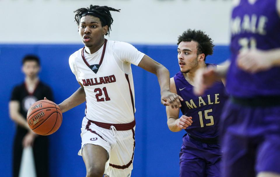 Ballard's Gabe Sisk brings up the ball as Male's Max Gainey guards in the 2023 LIT championship game Saturday. Jan. 14, 2023 