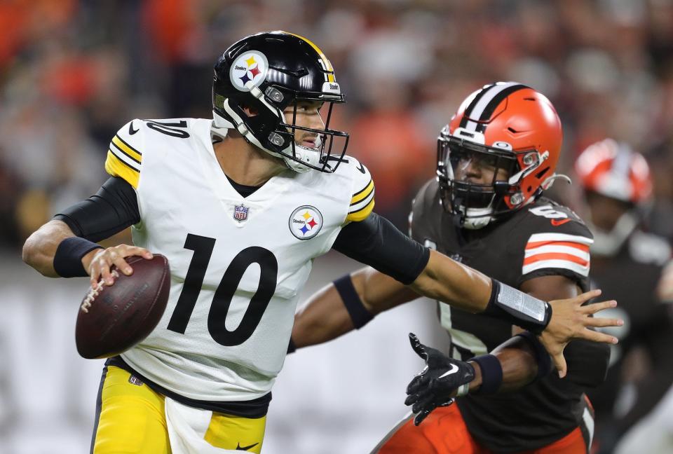 Steelers quarterback Mitch Trubisky is forced out of the pocket by Browns linebacker Anthony Walker Jr. during the first half Thursday, Sept. 22, 2022, in Cleveland.
