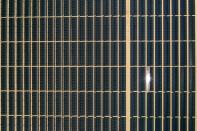 FILE PHOTO: Arrays of photovoltaic solar panels are seen at the Tenaska Imperial Solar Energy Center South as the spread of the coronavirus disease (COVID-19) continues in this aerial photo taken over El Centro, California