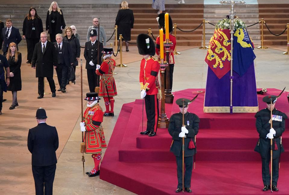 Britain's main opposition Labour Party deputy leader Angela Rayner (L) joins members of the public paying their respects to Queen Elizabeth II, as her coffin Lies in State inside Westminster Hall, at the Palace of Westminster in London on September 15, 2022.