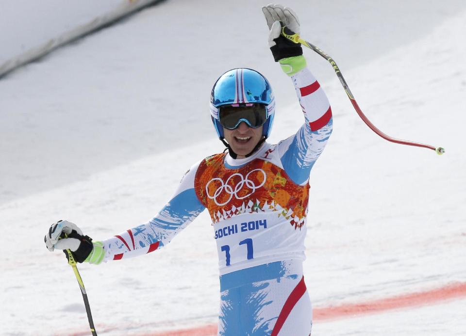 Austria's Matthias Mayer waves after finishing the men's downhill at the Sochi 2014 Winter Olympics, Sunday, Feb. 9, 2014, in Krasnaya Polyana, Russia. (AP Photo/Christophe Ena)