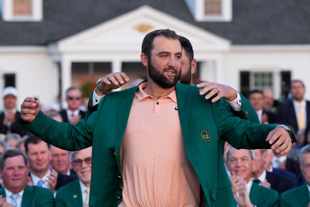 Jon Rahm puts the green jacket on Masters winner Scottie Scheffler