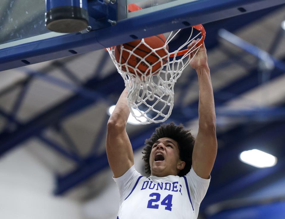 Braiden Whitaker dunks against Ida during a 57-50 Dundee victory Thursday night.