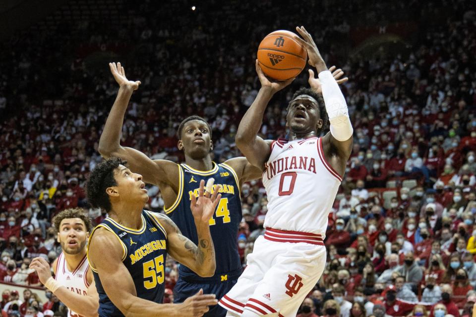 Indiana guard Xavier Johnson shoots the ball while Michigan guard Eli Brooks defends in the first half on Sunday, Jan. 23, 2022, in Bloomington, Indiana.