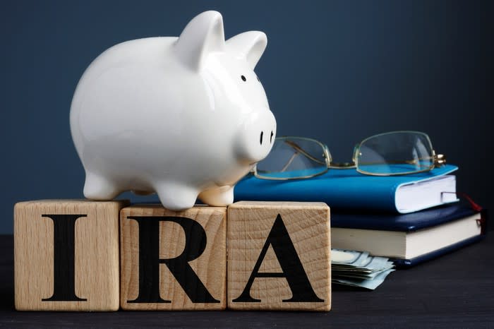 IRA letters with piggy bank, books and glasses