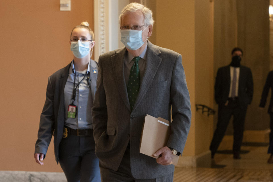 In this Oct. 21, 2020, photo, Senate Majority Leader Mitch McConnell of Ky., walks to the Senate Chamber on Capitol Hill in Washington. McConnell says there’s nothing the public needs to know about his health after photos showed what appears to be bruising on his hands and around his mouth. (AP Photo/Jacquelyn Martin)