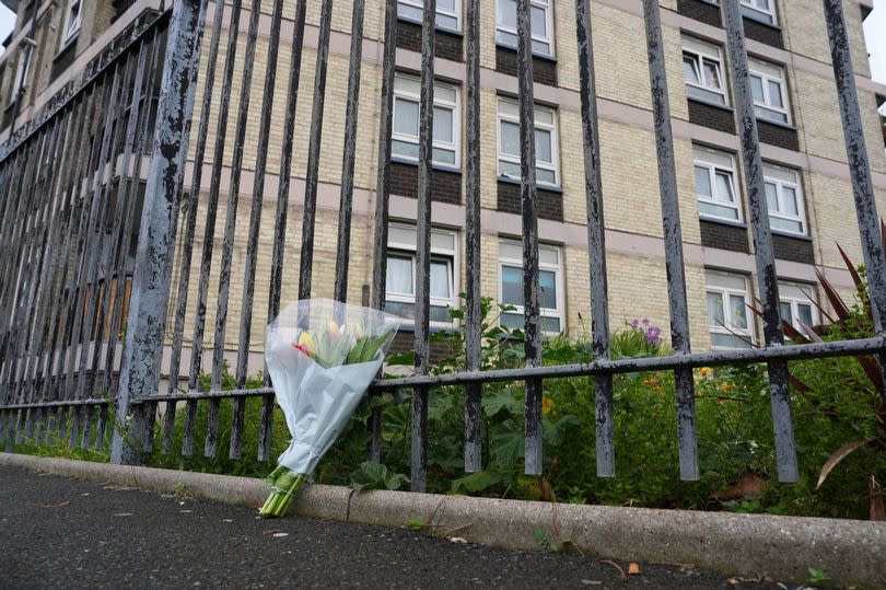 Floral tribute left near to the scene in Plaistow, east London, where a six-year-old boy died after falling from the upper floor of Jacobs House apartment bloc