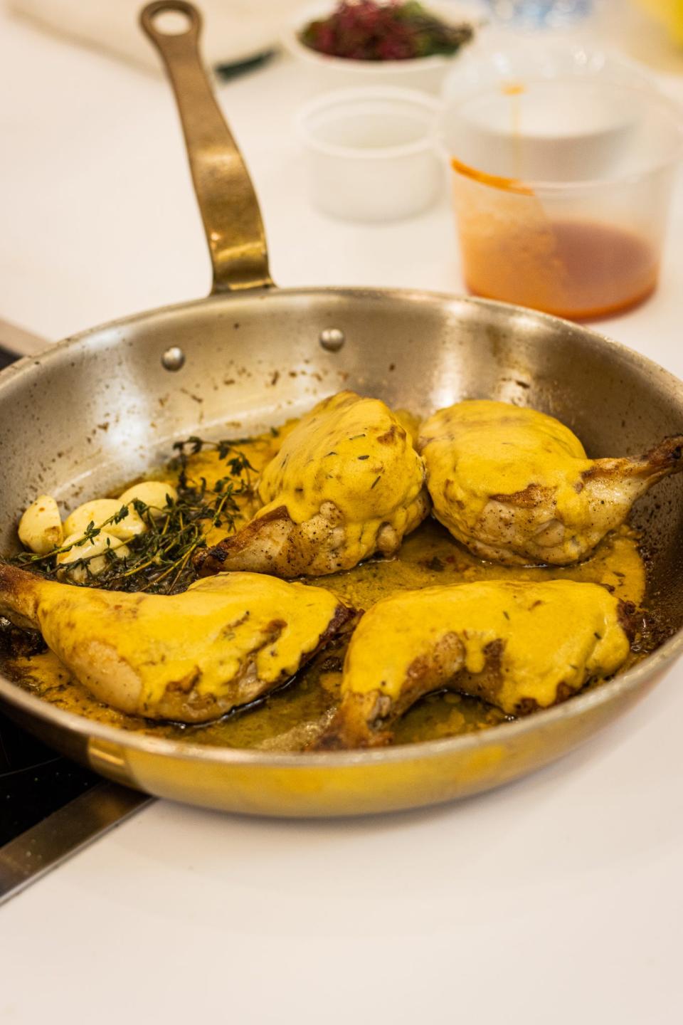 Chef William Dissen prepares chicken for guests in Doha, Qatar.