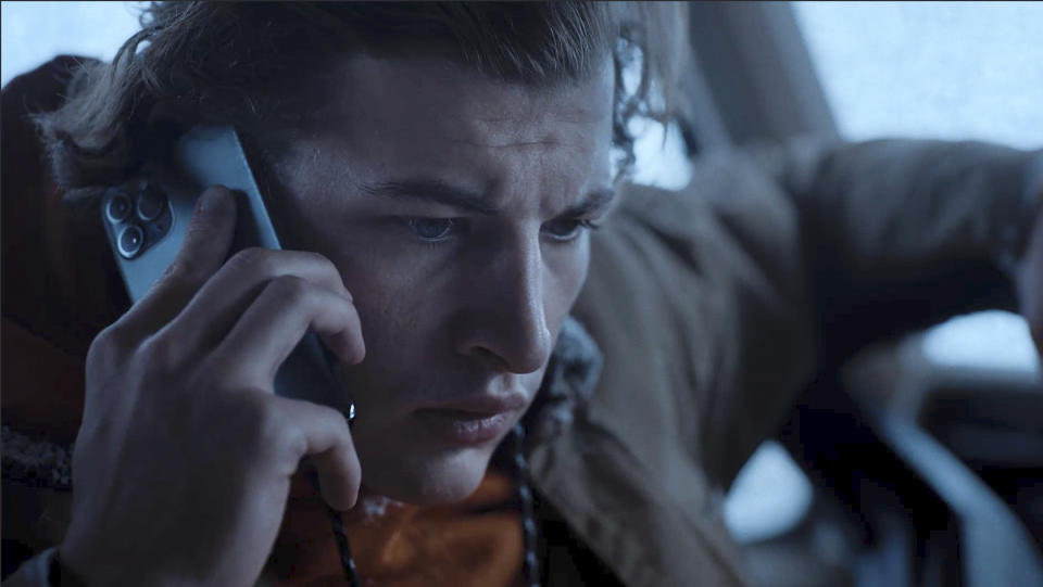 This image released by Quibi shows Tye Sheridan in a scene from "Wireless" which follows a college student navigating the snowy Colorado mountains. (Quibi via AP)