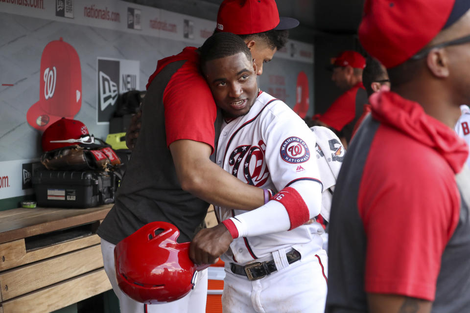 Washington Nationals' Victor Robles, center, celebrates with teammates after scoring on a single into shallow right field in the sixth inning of a baseball game against the Cleveland Indians at Nationals Park, Sunday, Sept. 29, 2019, in Washington. (AP Photo/Andrew Harnik)