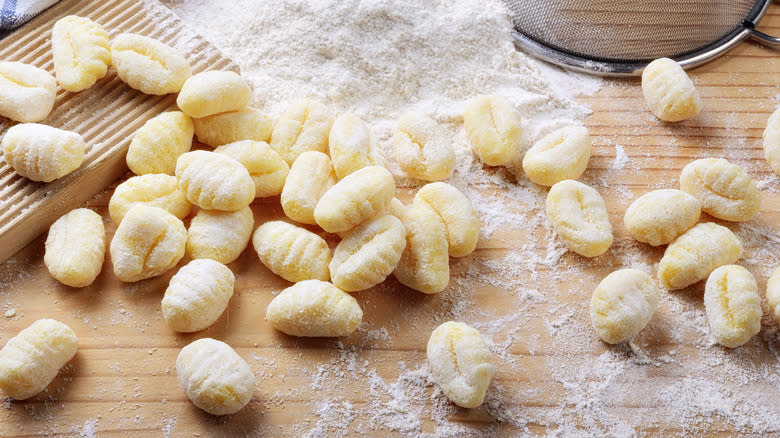 Fresh gnocchi on cutting board