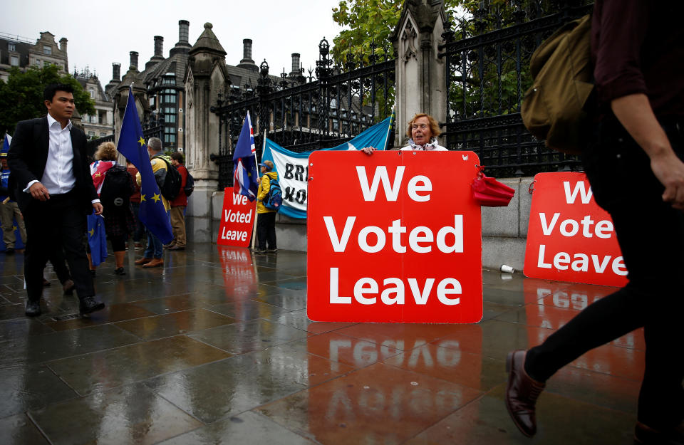 A pro-Brexit protester holds a placard in Westminster, London, Britain September 25, 2019. REUTERS/Henry Nicholls