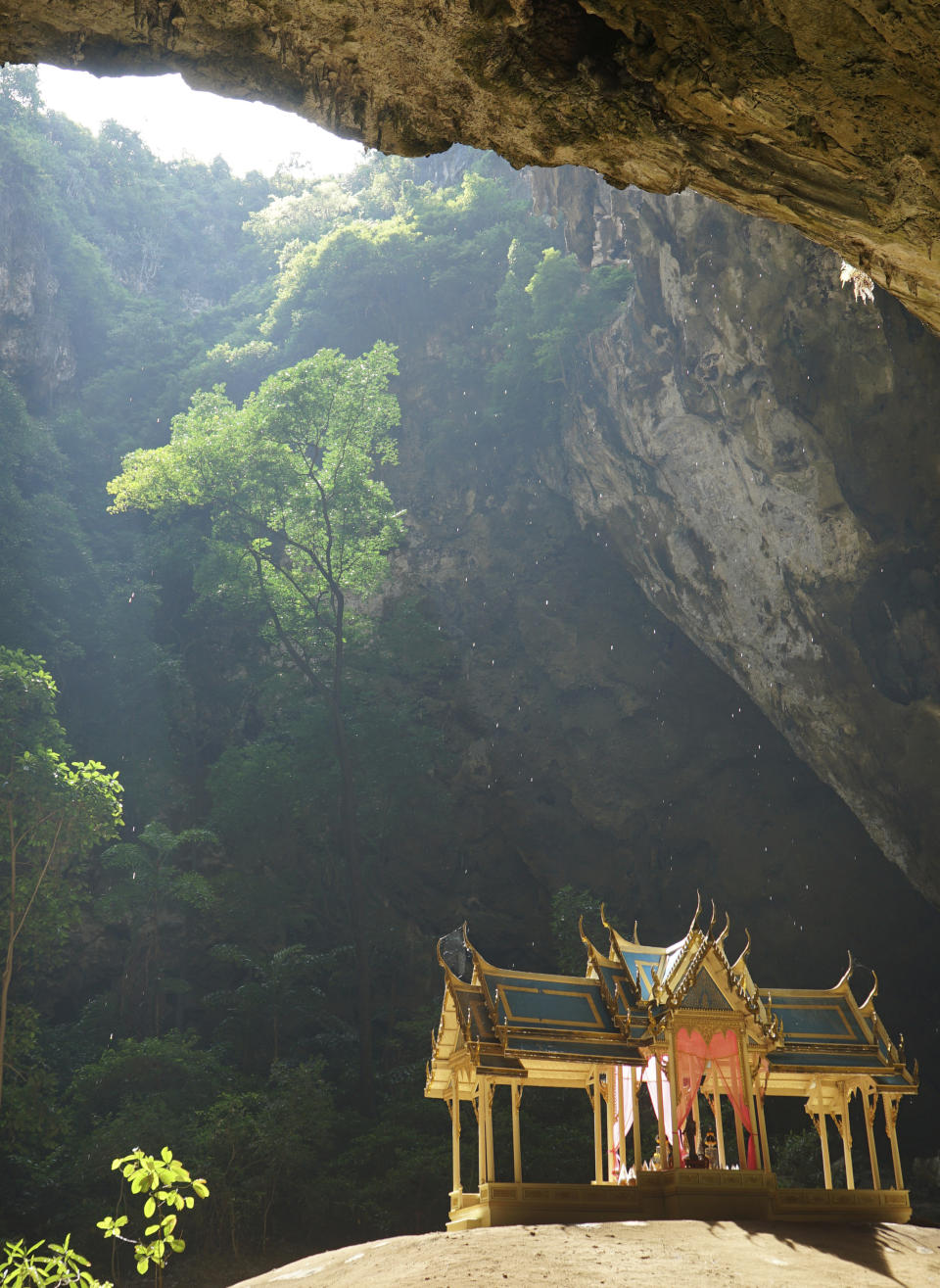 This Nov. 17, 2018 photo shows the royal pavilion drenched in sunlight inside the Phraya Nakhon Cave located in Thailand's Khao Sam Roi Yot National Park. Its lush hiking trails, wetlands and mangrove forests make Khao Sam Roi Yot National Park a weekend adventure worthy of topping your Thailand to-do list. (AP Photo/Nicole Evatt)