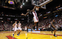 MIAMI, FL - FEBRUARY 23: Amare Stoudemire #1 of the New York Knicks has a shot blocked by Joel Anthony #50 of the Miami Heat during a game at American Airlines Arena on February 23, 2012 in Miami, Florida. NOTE TO USER: User expressly acknowledges and agrees that, by downloading and/or using this Photograph, User is consenting to the terms and conditions of the Getty Images License Agreement. (Photo by Mike Ehrmann/Getty Images)