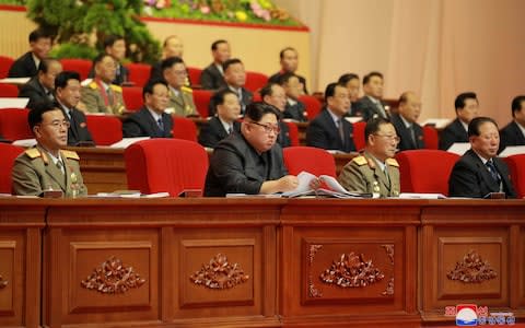 North Korean leader Kim Jong Un is seen as the 8th ammunition industry convention is held on December 11 in Pyongyang on Monday - Credit: Reuters