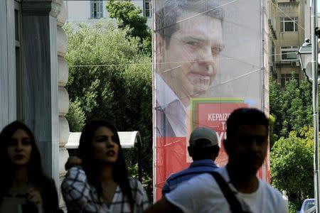 A banner showing former Greek Prime Minister and leader of leftist Syriza party Alexis Tsipras is seen in central Athens, Greece, September 11, 2015. REUTERS/Michalis Karagiannis