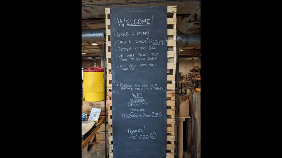 A welcome sign greets customers at the restaurant entrance at The Old Bakery Beer Company.