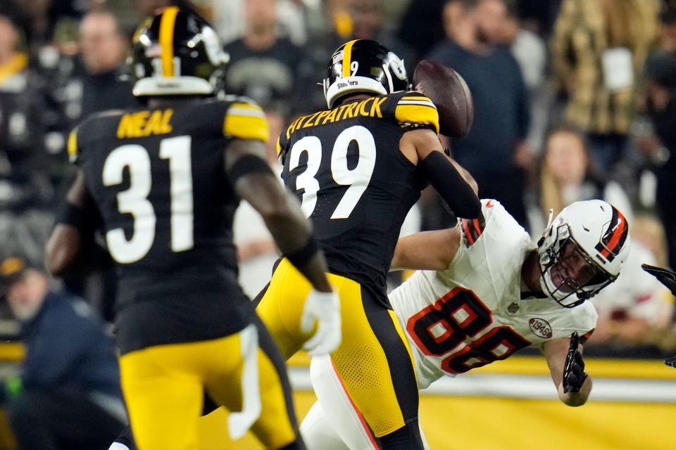Cleveland Browns tight end Harrison Bryant (88) loses the ball as he is hit by Pittsburgh Steelers safety Minkah Fitzpatrick (39) during the first half Monday night in Pittsburgh.