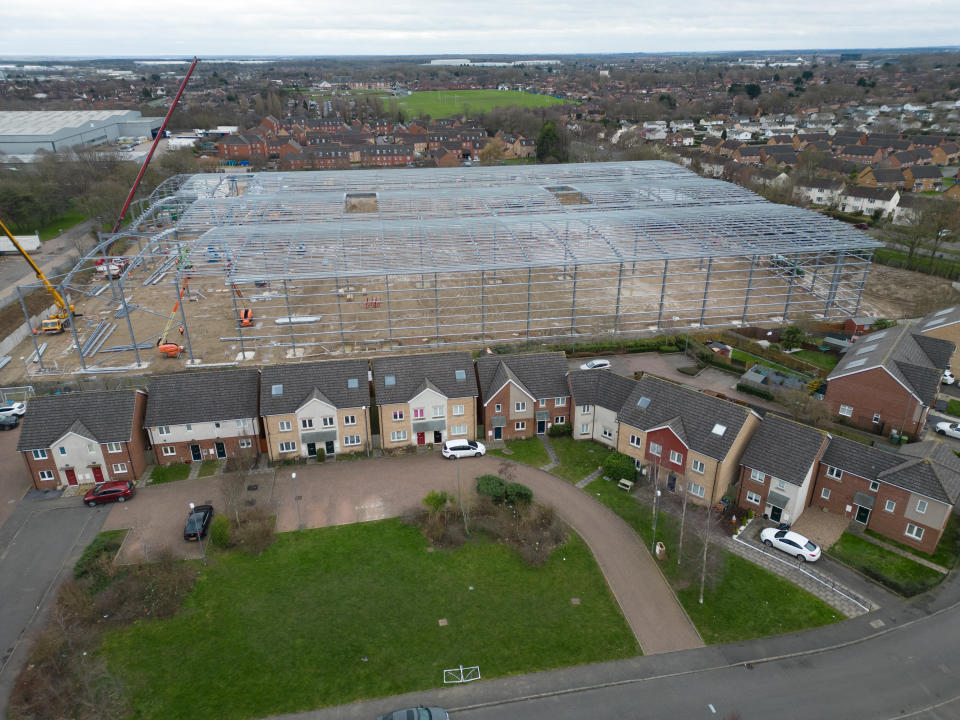 Hooke Close properties. Residents in Corby are stunned by the huge factory being built just feet from their homes without consultation after the wrong street was spoken to before construction began. Instead of going to Hooke Close, NNC went to Hubble Road, a street near the other Corby Weetabix site. Photo released February 6 2024. See SWNS story SWLSfactory. Fuming locals say they are living next to a 60ft-high â€œmonsterâ€ warehouse â€“ after bungling council officials consulted the WRONG street.Homeowners in Corby, Northants., woke up to see a huge metal frame of the industrial units being erected just feet away from their back doors.Bemused neighbours contacted the council to ask why they had not been informed only to discover officials mixed up the street with another road.Officials mistakenly consulted people living on Hubble Road instead of Hooke Close to ask their opinions about the massive 160,800 sq ft development.
