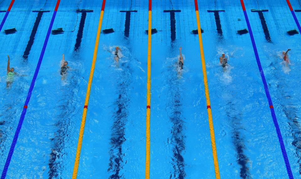 <p>An overview shows swimmers competing in a heat for the women's 200m backstroke swimming event during the Tokyo 2020 Olympic Games at the Tokyo Aquatics Centre in Tokyo on July 29, 2021. (Photo by FranÃ§ois-Xavier MARIT / AFP) (Photo by FRANCOIS-XAVIER MARIT/AFP via Getty Images)</p> 