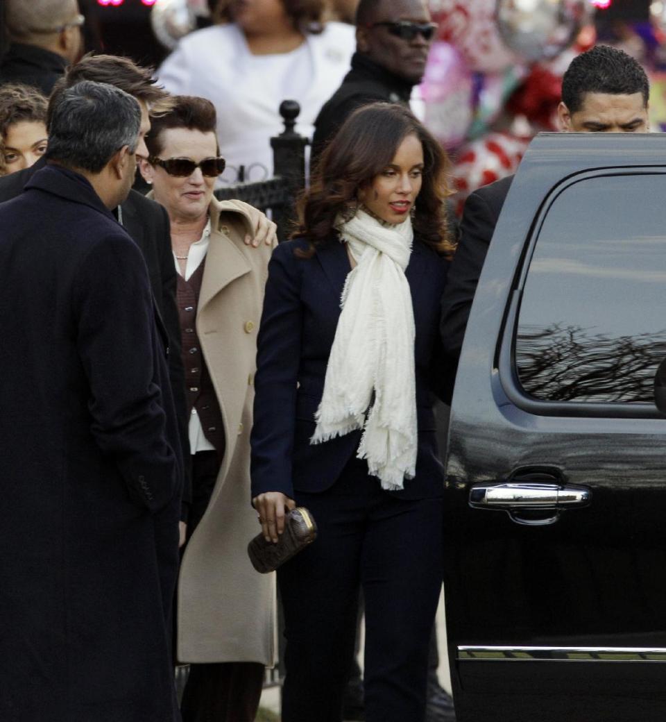 Singer Alicia Keys, center, leaves after a funeral service for Whitney Houston at New Hope Baptist Church in Newark, N.J., Saturday, Feb. 18, 2012. Houston died last Saturday at the Beverly Hills Hilton in Beverly Hills, Calif., at the age 48. (AP Photo/Mel Evans)