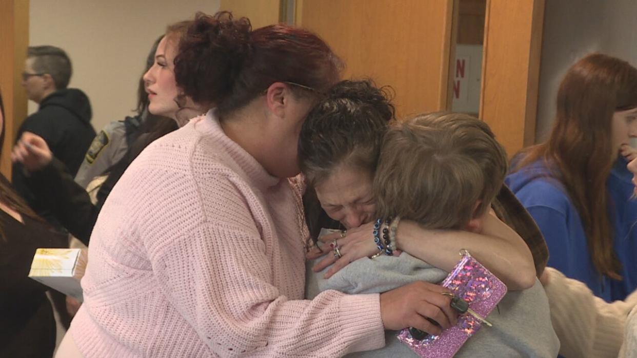 Talia Forrest's family hugged outside the courtroom following the guilty verdict. (Kyle Moore/CBC - image credit)