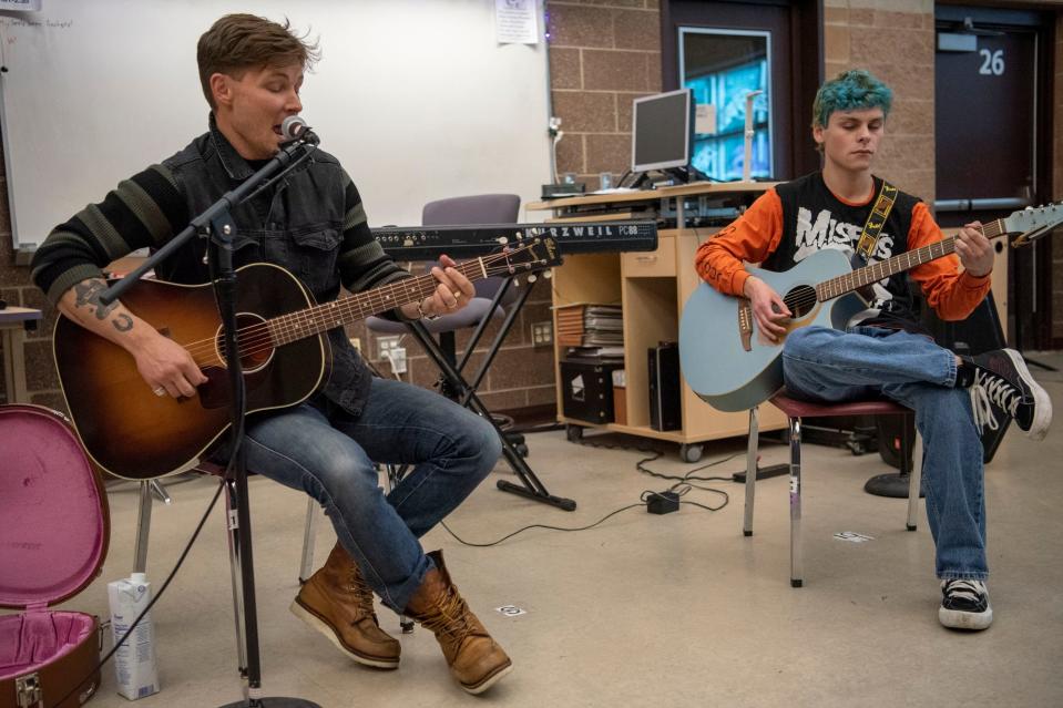 Country music singer Frankie Ballard and senior Vinny Rose lead guitar class at Lakeview High School in Battle Creek, Michigan on Thursday, May 5, 2022. 