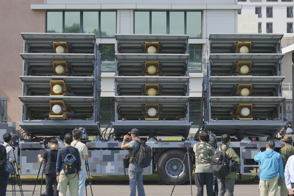 Members of the media look at the Chien Hsiang anti radiation loitering munition launcher at the National Chung-Shan Institute of Science and Technology in Taichung in central Taiwan on Tuesday, Nov. 15, 2022. Taiwan displayed its self-developed drone technology Tuesday, amid rising concerns over China's threats to use force to assert its claim to the self-governing island republic. (AP Photo/Walid Berrazeg)