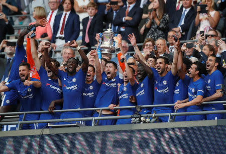 Soccer Football - FA Cup Final - Chelsea vs Manchester United - Wembley Stadium, London, Britain - May 19, 2018 Chelsea's Gary Cahill lifts the trophy as Chelsea celebrate winning the final REUTERS/David Klein