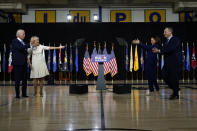 Sen. Kamala Harris, D-Calif., and her husband Douglas Emhoff, right, applaud to Democratic presidential candidate former Vice President Joe Biden and his wife Jill Biden after a campaign event at Alexis Dupont High School in Wilmington, Del., Wednesday, Aug. 12, 2020. (AP Photo/Carolyn Kaster)