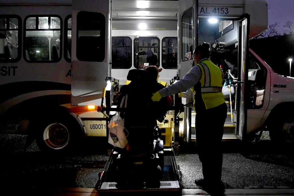 Amanda Chirelli drives herself onto Access Link’s wheelchair lift on Friday, December 16, 2022 in Long Branch, New Jersey. Chirelli’s four hour commute home to Little Egg Harbor caps a lunch social with a friend, who also has cerebral palsy, in Long Branch. Chirelli said she wished she had friends or mentors with the same disability so she would have known someone who was going through the same challenges. 