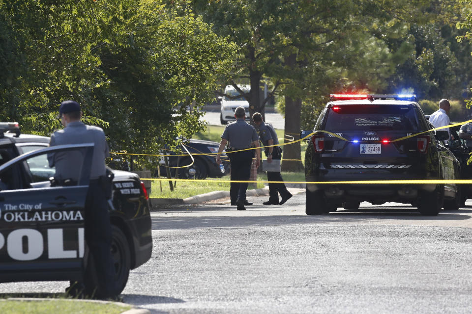 Crime scene tape closes off an area where a shooting suspect was fatally shot during a police chase Monday, Sept. 9, 2019, in northwest Oklahoma City. (AP Photo/Sue Ogrocki)