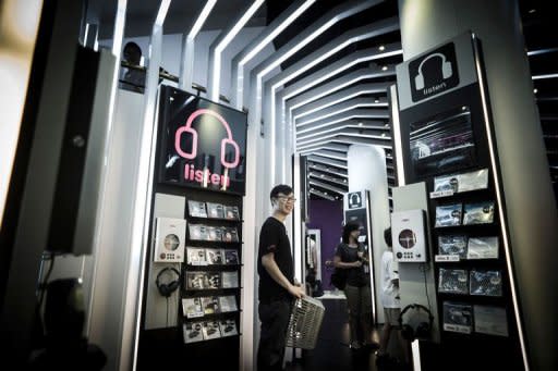 A shop employee in a music store in Hong Kong. China has seen an estimated 99% digital piracy rate in recent years, meaning the legitimate market has operated at only a fraction of its true potential, according to the IFPI