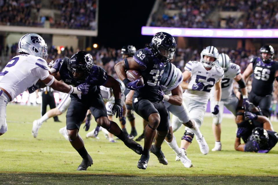 TCU running back Kendre Miller (33) scores a touchdown against Kansas State during the fourth quarter of their 2022 game at Amon G. Carter Stadium.