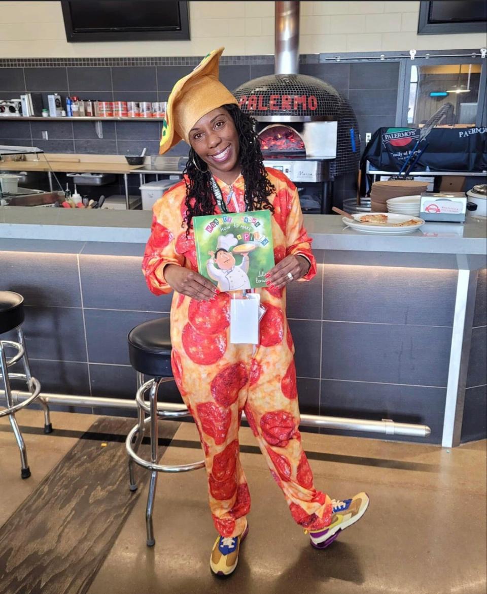 Dannette Justus, an academic coach at Siefert Elementary School in Milwaukee, reads books anywhere, including wearing this pepperoni pizza costume.