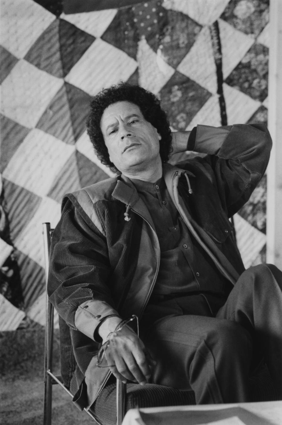 Gaddafi has got this leisure outfit just right - and he knows it. Padded corduroy jacket with press studs cuffs and a draw string collar were all the rage back in 1985.     Gaddafi in Libya, February 1985.
