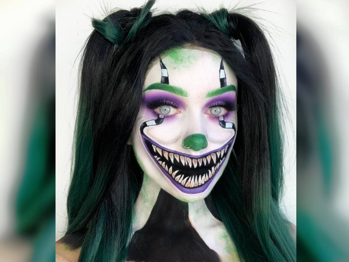 This Halloween makeup look, a cross between Pennywise the clown from the movie It and Beetlejuice, is one of more than a dozen that Winnipeg artist Maddy Harms has posted so far this month. (Submitted by Maddy Harms - image credit)