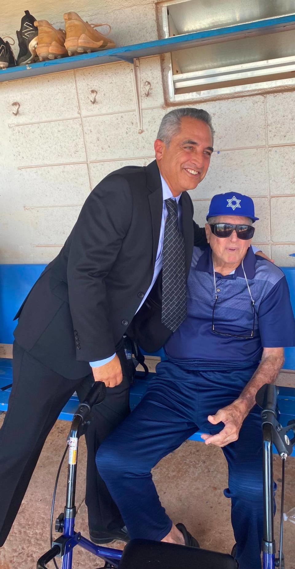 New Miami Dade College baseball coach Lazaro Llanes poses for a photo with former Sharks coaching legend Steve Hertz.