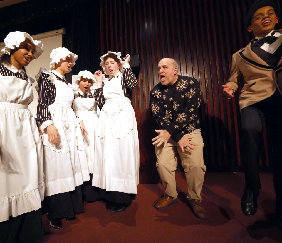 Robert Hogan, theatre director at Brockton Public Schools, does the hokey pokey with cast members before Brockton High School Drama Club's dress rehearsal of "Charley's" Aunt on Thursday, Feb. 29, 2024. The Brockton players will compete in the Massachusetts Educational Theater Guild festival finals this weekend.